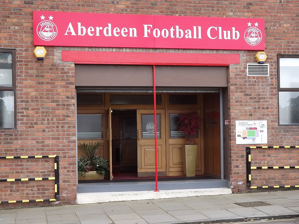 building with a red Aberdeen Football Club sign