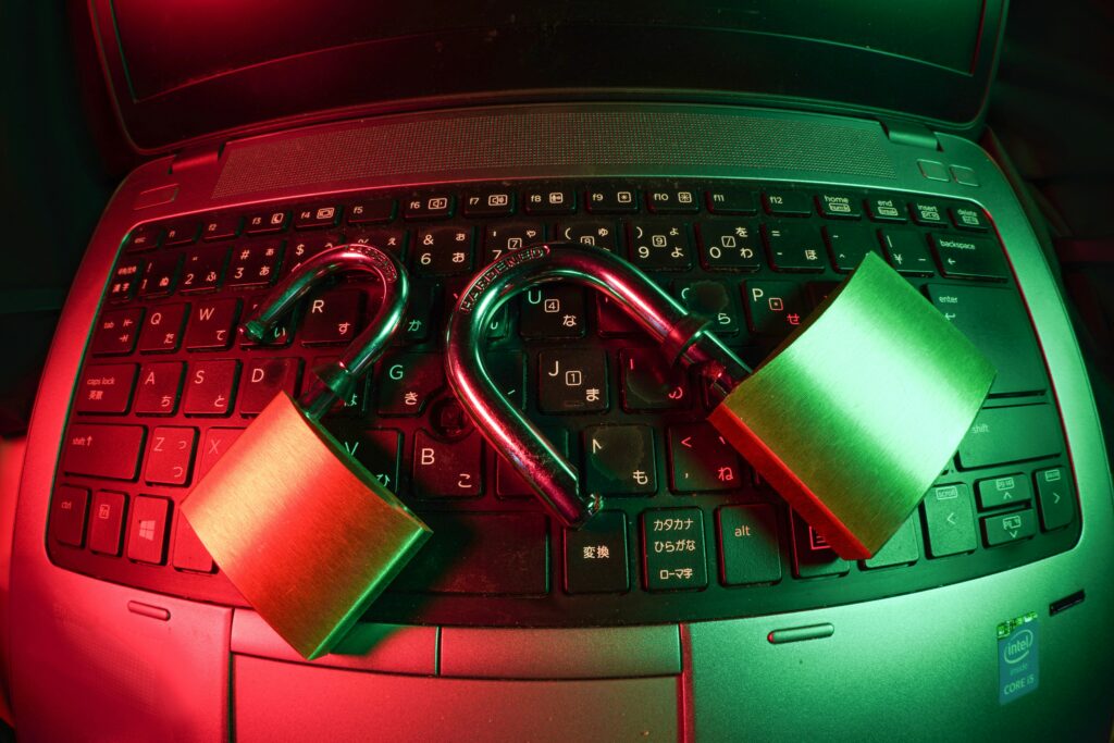 two padlocks on a laptop keyboard | CAOSYS launches CS Applications in a commitment to Oracle E-Business Suite